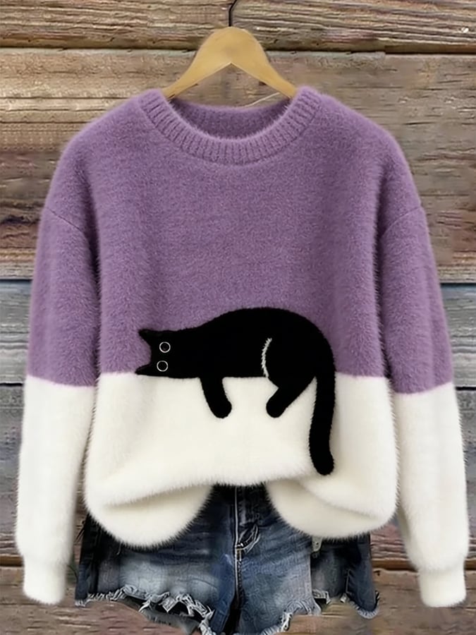 MAGLIONE LARGO A MOTIVO PER DONNE