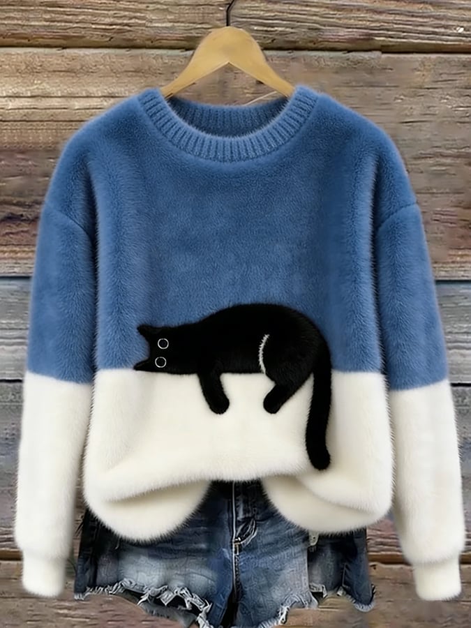 MAGLIONE LARGO A MOTIVO PER DONNE