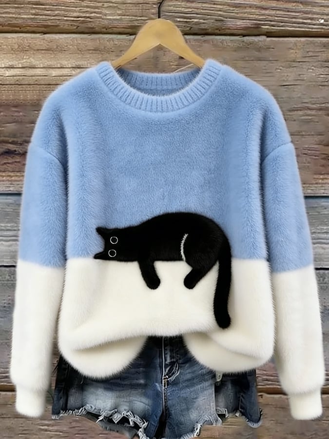 MAGLIONE LARGO A MOTIVO PER DONNE