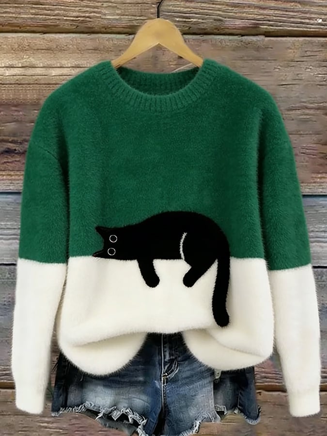 MAGLIONE LARGO A MOTIVO PER DONNE