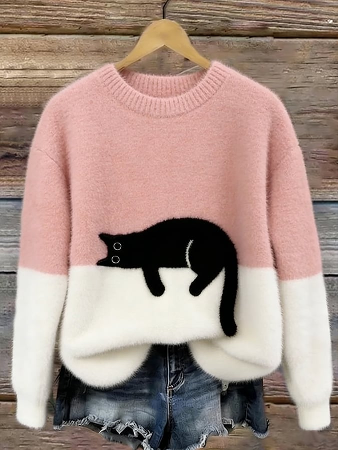MAGLIONE LARGO A MOTIVO PER DONNE