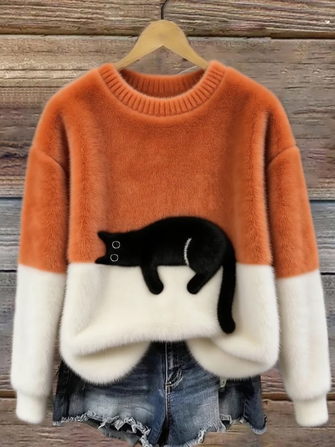 MAGLIONE LARGO A MOTIVO PER DONNE